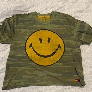 Camo aviator nation smiley shirt size small. See pics, small pin holes at bottom